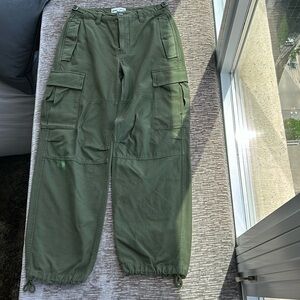 TNA (Aritzia) army green cargo pants with tie ankle detail.